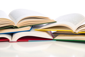 Stack of opened textbooks