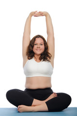 woman with overweight involved in fitness on mat