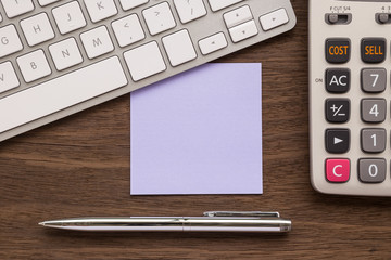 Blank purple paper on workspace for note