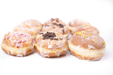 Obraz na płótnie Canvas Fresh isolated donuts on white background