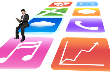 Manager using tablet sitting on shiny app icons white background