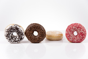 Jummy fresh isolated donuts on white background