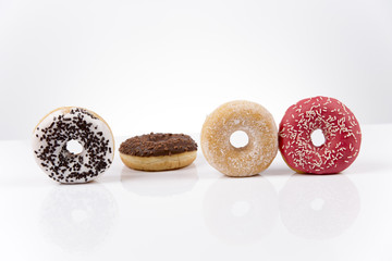 Jummy fresh isolated donuts on white background