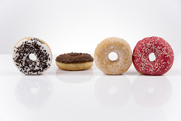 Jummy fresh isolated donuts on white background
