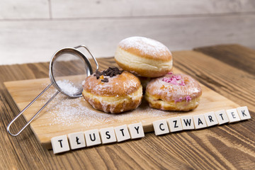 Jummy donuts on wooden table - 77854315