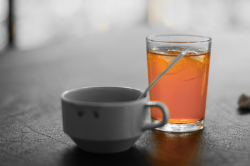 Cup of coffee and orange juice on a wooden table