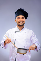 Portrait of young handsome cook