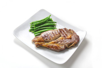 large beef steak with green beans