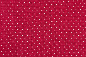 Red and white dots woolen texture.Knit shapes pattern background