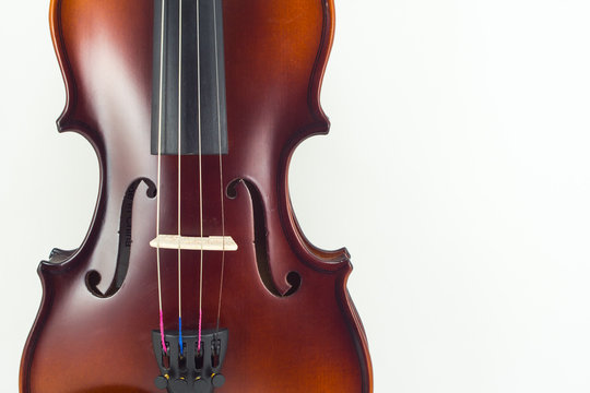 Wooden violin on white background