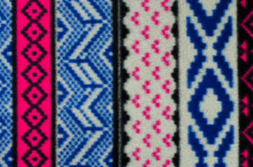 Knit woolen texture. Blue geometric shapes pattern background.