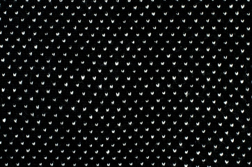 Black white dots woolen texture. Knit shapes pattern background.