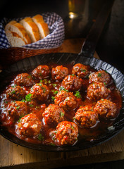 Succulent fried meatballs in a spicy sauce