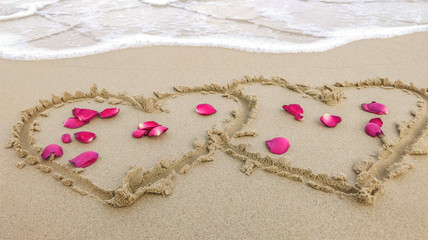 Heart and rose on the sand beach in phuket Thailand
