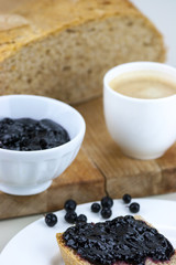 Homemade blueberry jam with integral bread and coffe