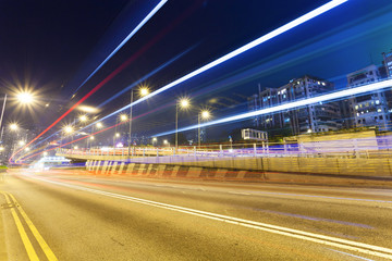 Fototapeta na wymiar traffic light trails in modern city at night