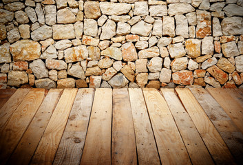 wooden slats with stone wall