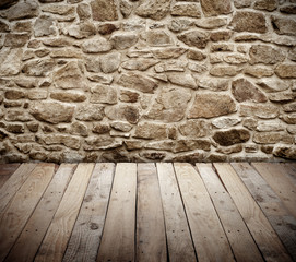 stone wall with wooden floor