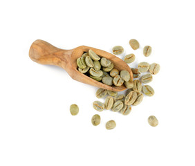 green coffee beans in a wooden scoop
