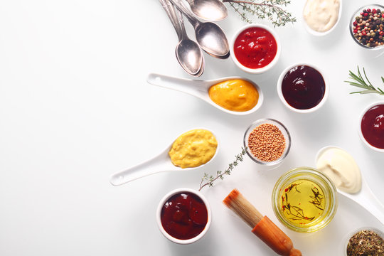 Various Spicy Rubs and Marinades on White Table