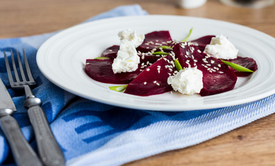 roasted beet salad with goat cheese and sesame seeds, snack