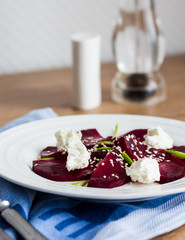 roasted beet salad with goat cheese and sesame seeds, snack
