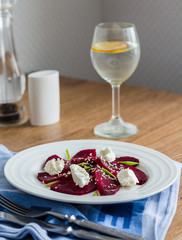 beet salad with goat cheese, garlic and sesame seeds