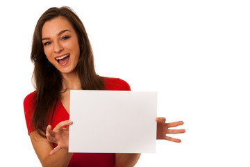 Fototapeta premium Beautiful young business woman showing a blank card isolated ove