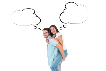 Happy casual man giving pretty girlfriend piggy back