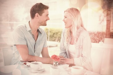 Hip young couple having desert and coffee together