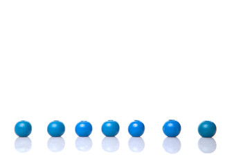 Blue round wooden beads over white background