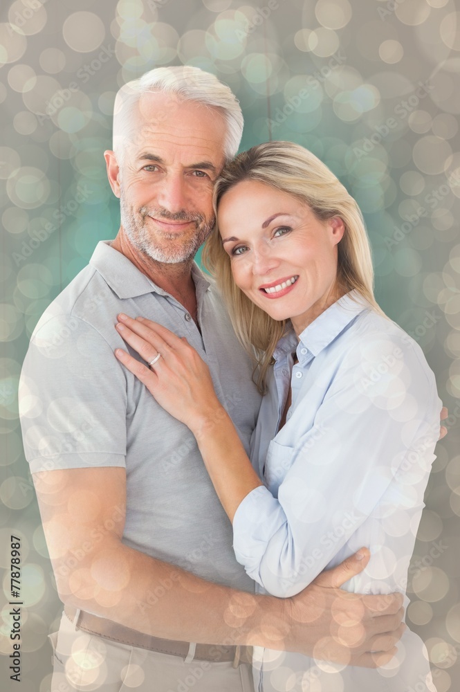 Poster Composite image of happy couple standing and smiling at camera