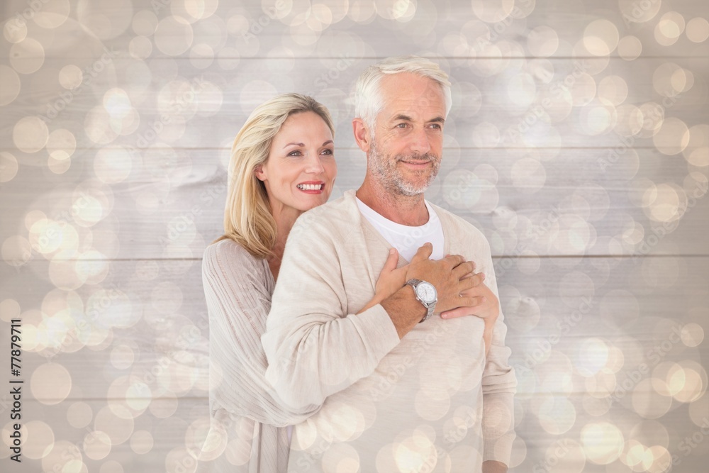 Poster composite image of happy couple standing and hugging