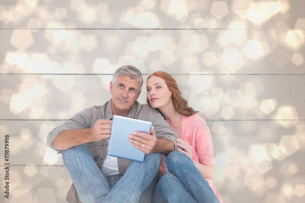 Poster composite image of casual couple sitting using tablet