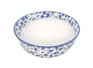 Coarse sea salt in a blue and white china bowl