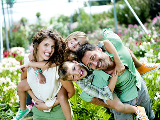 family having fun in a greenhouse