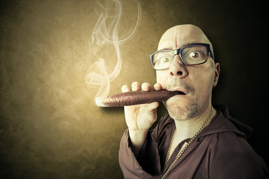 hidden priest smoking big sigar