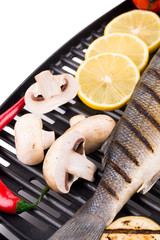 Grilled seabass on grill