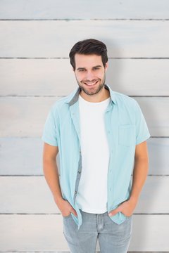 Composite image of happy casual man smiling at camera