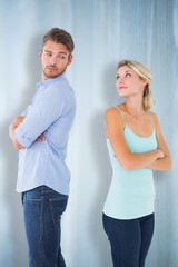 Composite image of unhappy couple not speaking to each other
