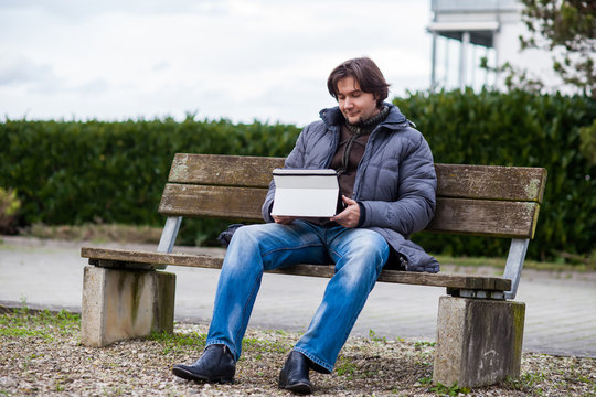 Man with tablet outdoor