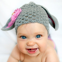 Happy baby like a bunny or lamb