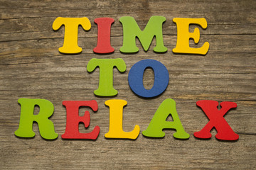 Time To Relax text on a wooden background