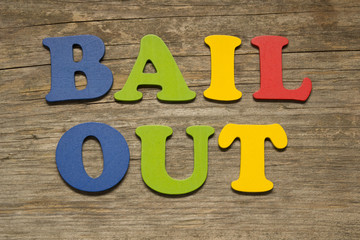 Bail out text on a wooden background