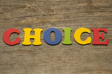 Fototapeta premium The word Choice on a wooden background