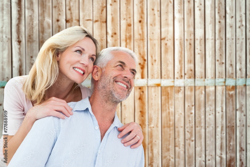 Poster composite image of smiling couple embracing and looking