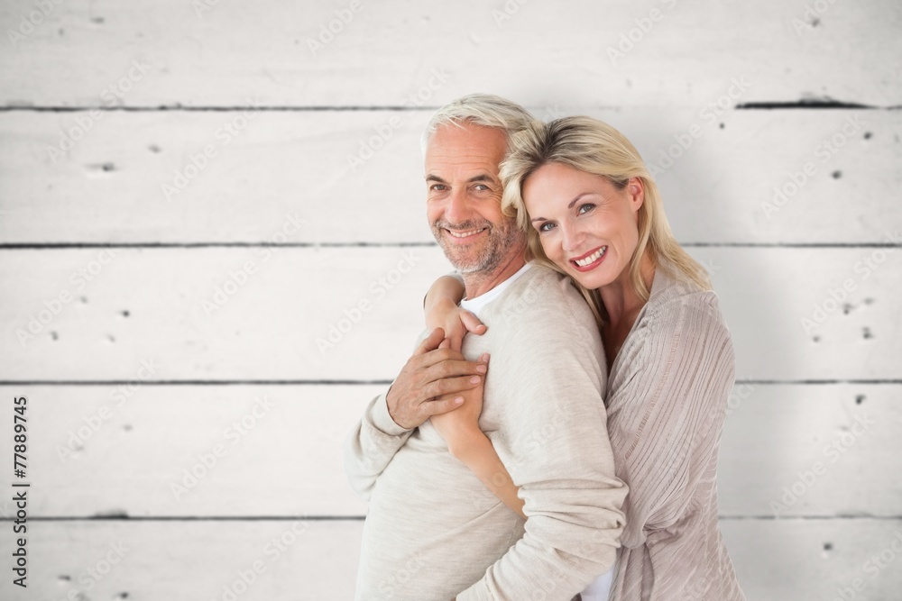 Aufkleber composite image of happy couple standing and hugging