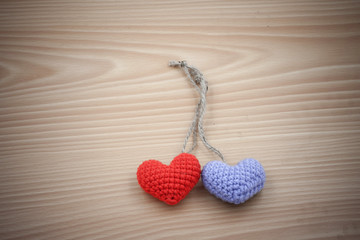 Vintage  Yarn hearts on wood background