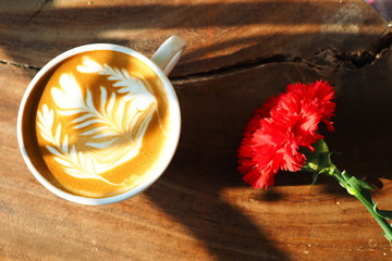 cup of coffee latte art on the wood background in vintage color