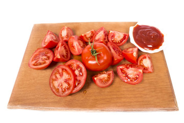 ripe juicy tomatoes on a cutting board